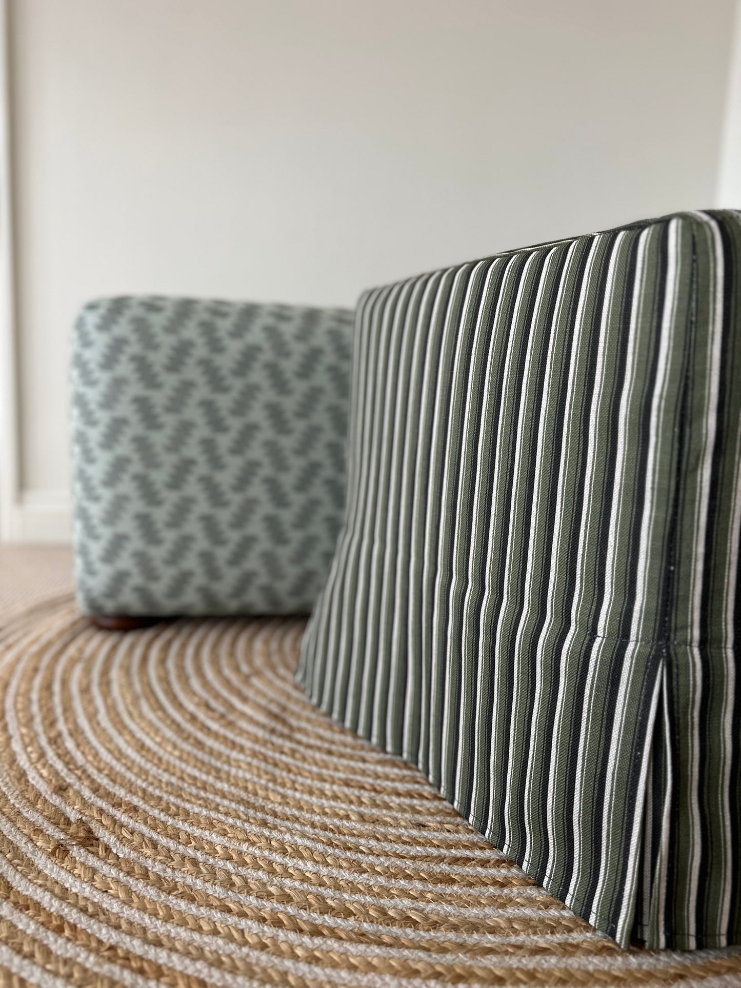 Skapa Ottoman with tailored slipcover