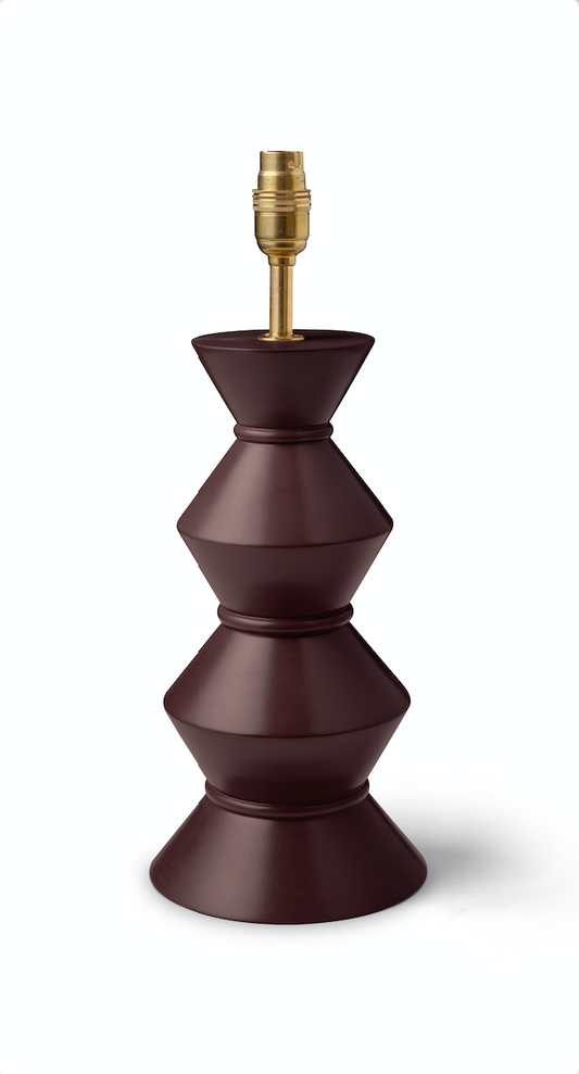A modern tiered table lamp base in a deep matte burgundy-brown, featuring a brass-colored socket at the top, shown on a clean white background.