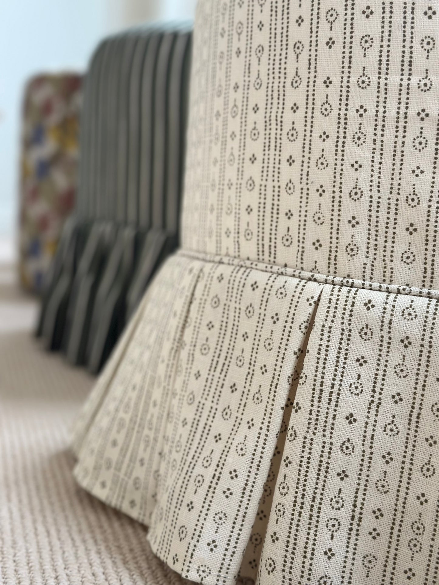Trendel ottoman with box pleat slipcover