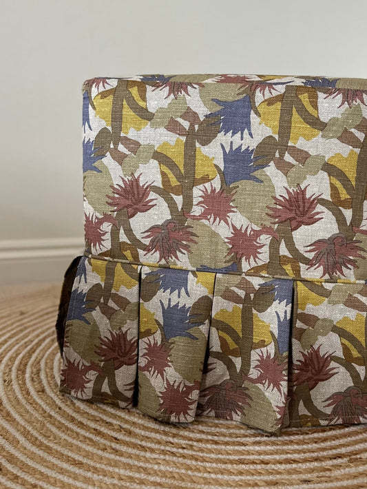 Skapa Ottoman with box pleat slipcover