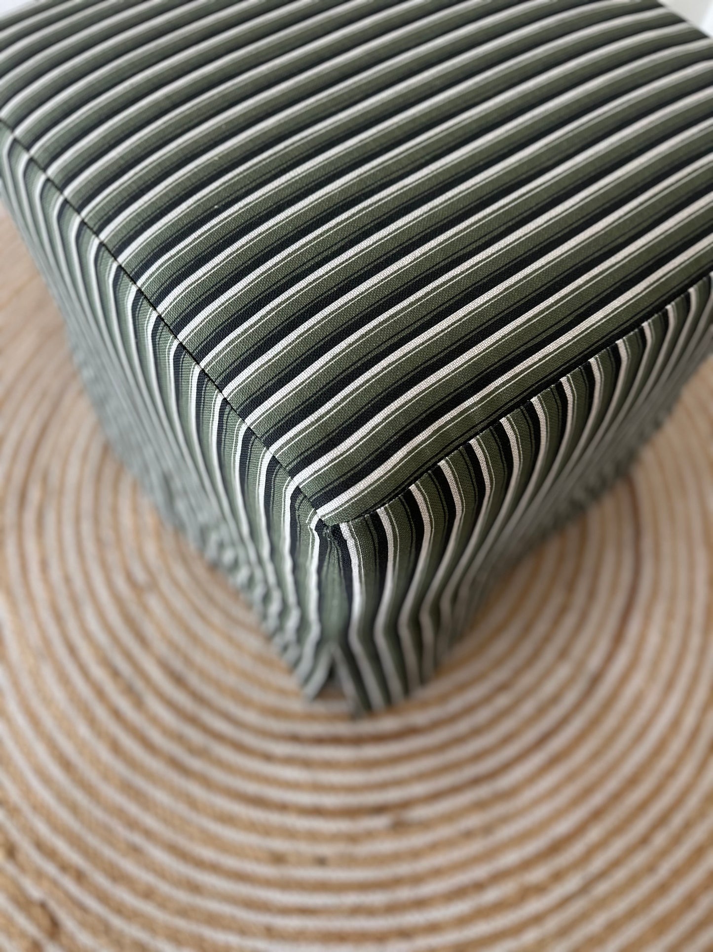Skapa Ottoman with tailored slipcover