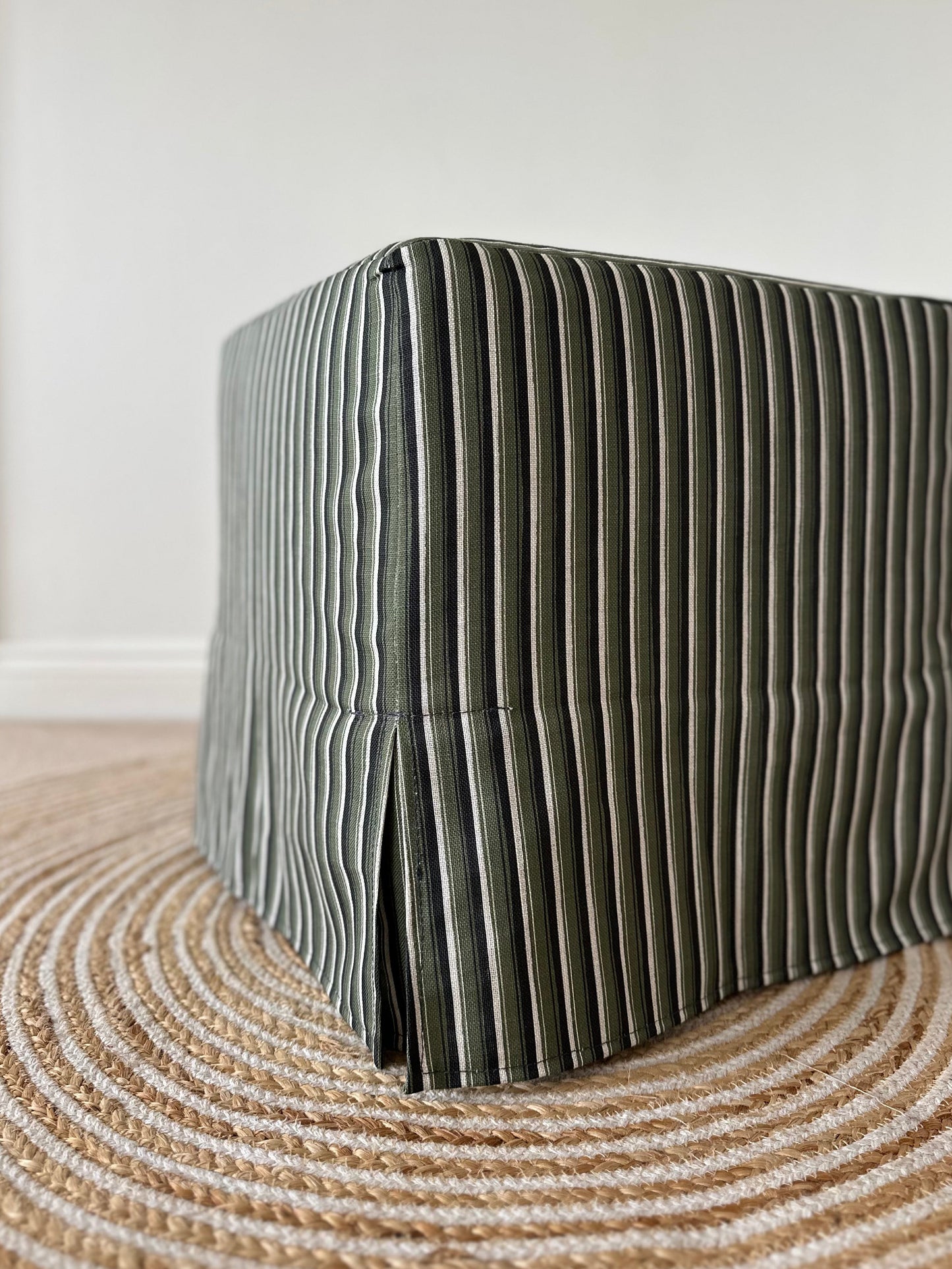 Skapa Ottoman with tailored slipcover
