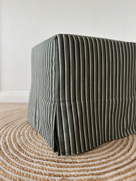 Skapa Ottoman with tailored slipcover