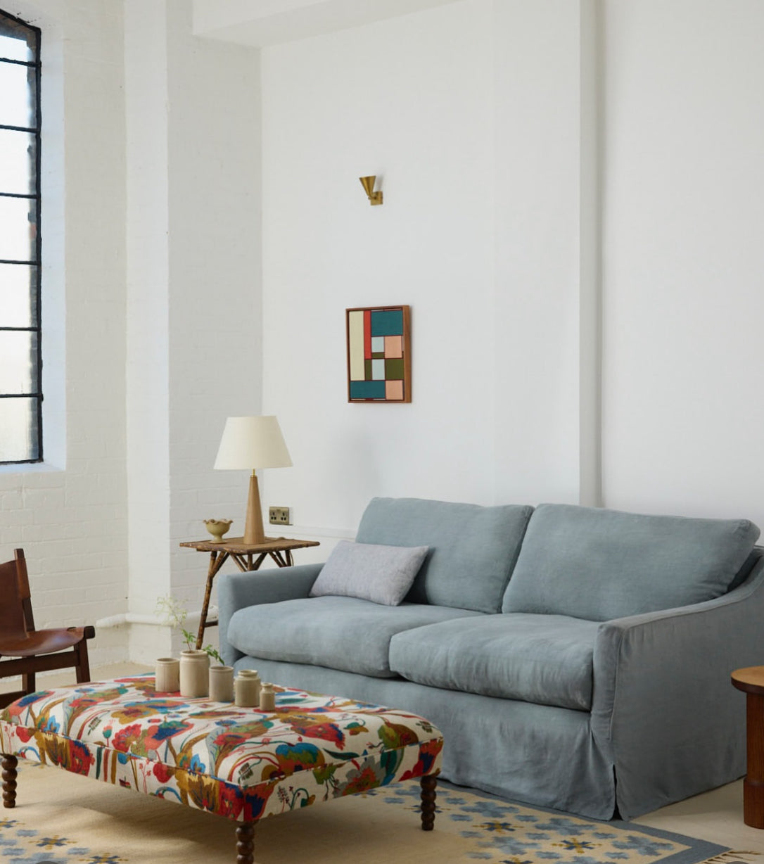Sonder sofa in blue linen with wish ottoman