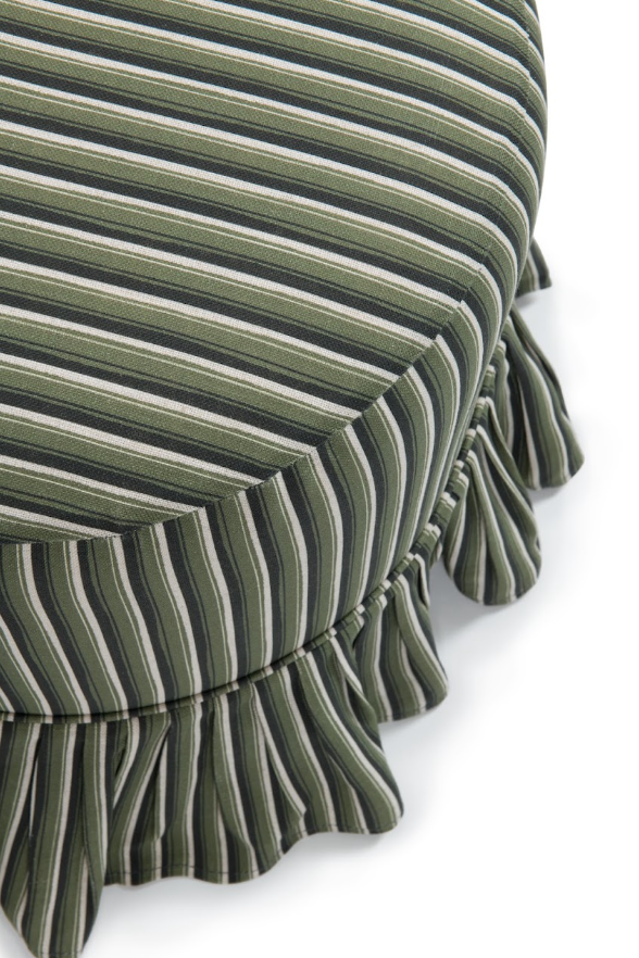 Close-up of a striped fabric frill slipcover Trendel drum ottoman with ruffled trim, featuring vertical stripes in olive green, cream, and dark green on a white background.