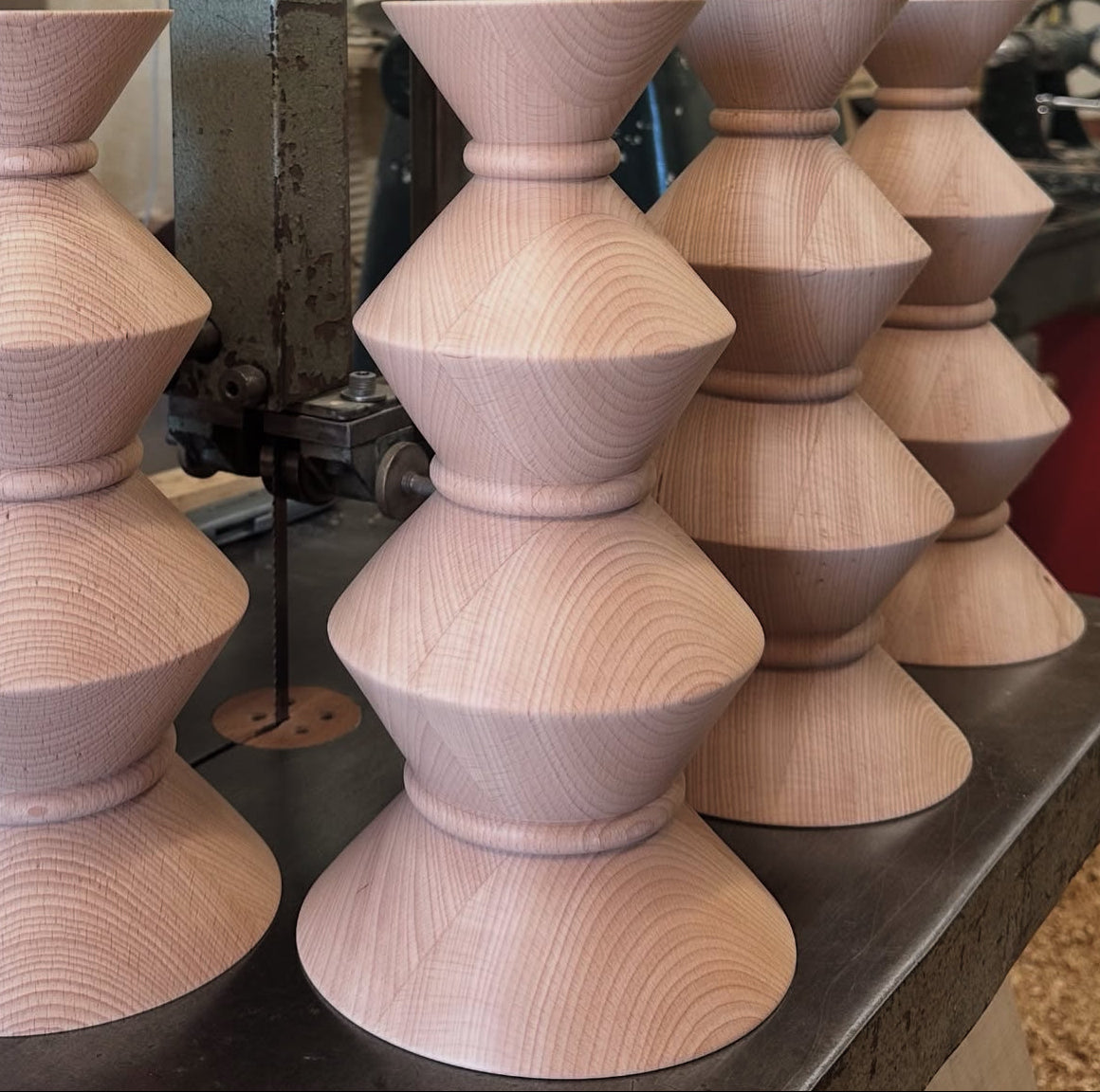 A collection of Ziggy bases freshly turned by hand at the workshop